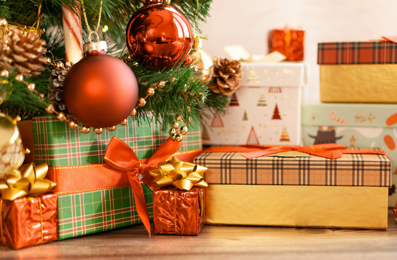 a christmas tree with presents under it
